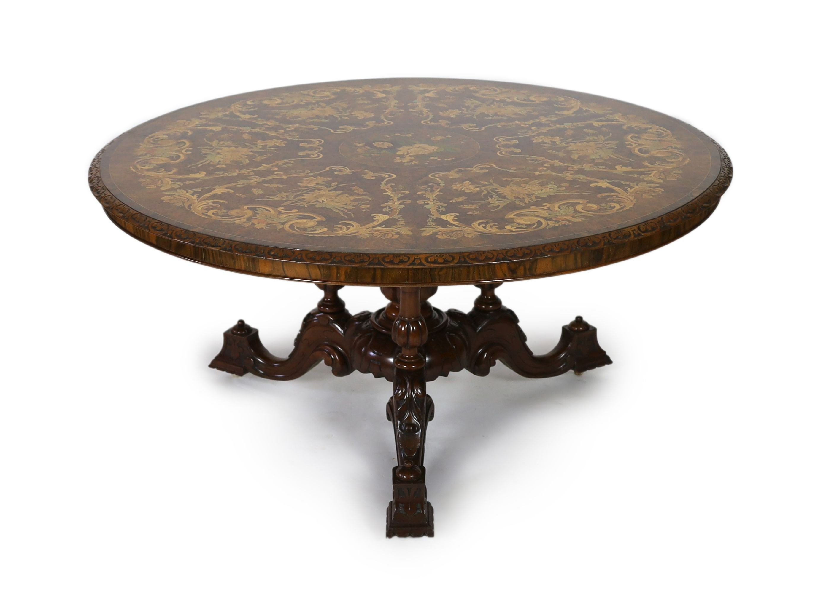 A Victorian walnut and marquetry breakfast table, diameter 144cm H.77cm